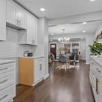 Elegant white kitchen cabinets with gold hardware in modern kitchen design.