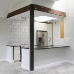 Sleek modern kitchen with custom cabinets and stainless steel appliances for stylish living.