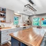 Elegant kitchen with custom cabinets and modern lighting, perfect for premium cabinet design and renovation.