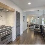 Modern kitchen with premium cabinets, stainless steel appliances, and elegant open-concept design.