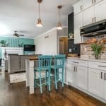 Custom kitchen cabinets with modern design and farmhouse style in a vibrant home interior.
