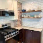 Custom kitchen cabinetry with white and dark wood finishes in a modern aesthetic.