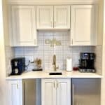 Elegant white kitchen cabinets with gold hardware, perfect for modern custom cabinetry.