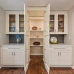 High-quality white built-in kitchen cabinets with glass doors and open shelving for modern storage solutions.