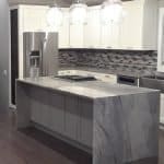 Elegant kitchen with custom cabinets and marble island for modern home interiors.