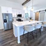 Sleek white custom cabinets with modern finishes for a stylish kitchen design.