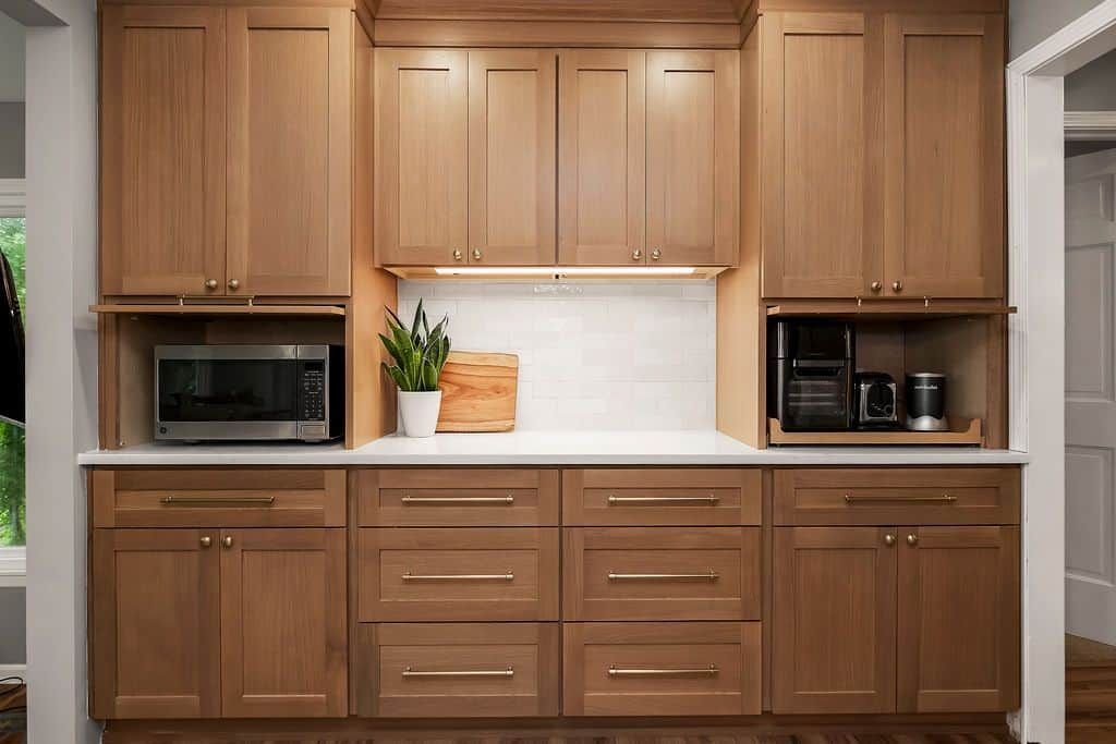 Natural wood shaker kitchen cabinets with built-in appliance nook, kitchen remodel in Olathe, KS