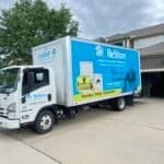 Habitat for Humanity KC ReStore truck picking up donated kitchen cabinets during a remodel deconstruction in Shawnee, KS