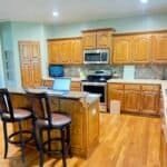 Golden oak kitchen cabinets before remodel in Shawnee, KS