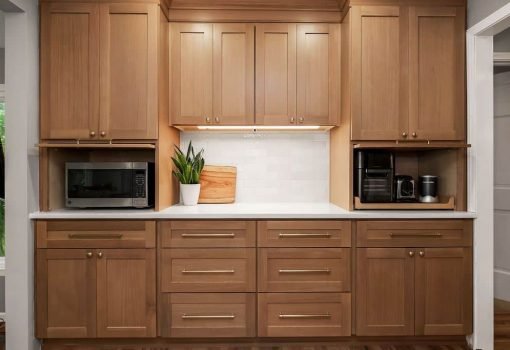 Natural wood shaker kitchen cabinets with a built-in appliance nook in an Olathe, KS kitchen remodel.